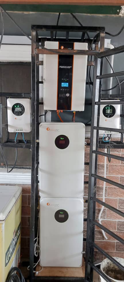 Hybrid inverter and lithium battery bank mounted on a steel rack